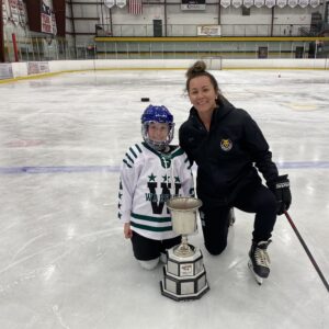 Ainsley and Coach Taylor with the Isobel Cup