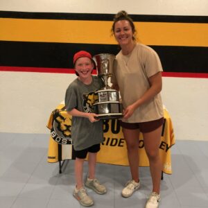 Mikey and Coach Taylor with the Isobel Cup